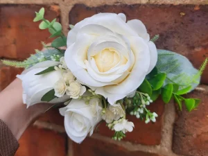 front view of an ivory dog corsage